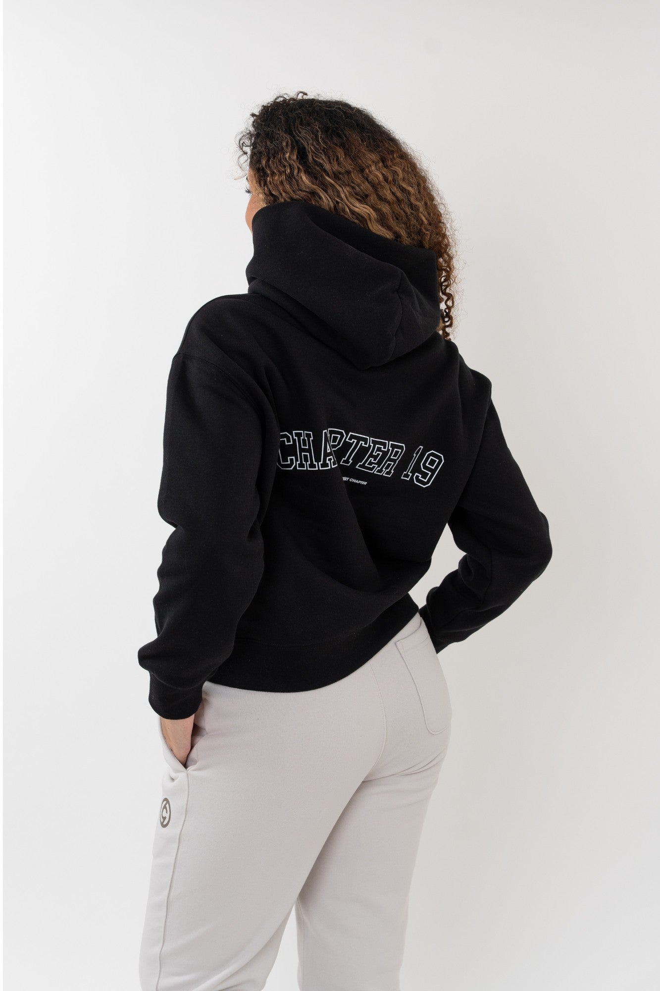 rear logo detail of dancer style chapter 19 black hoodie for women