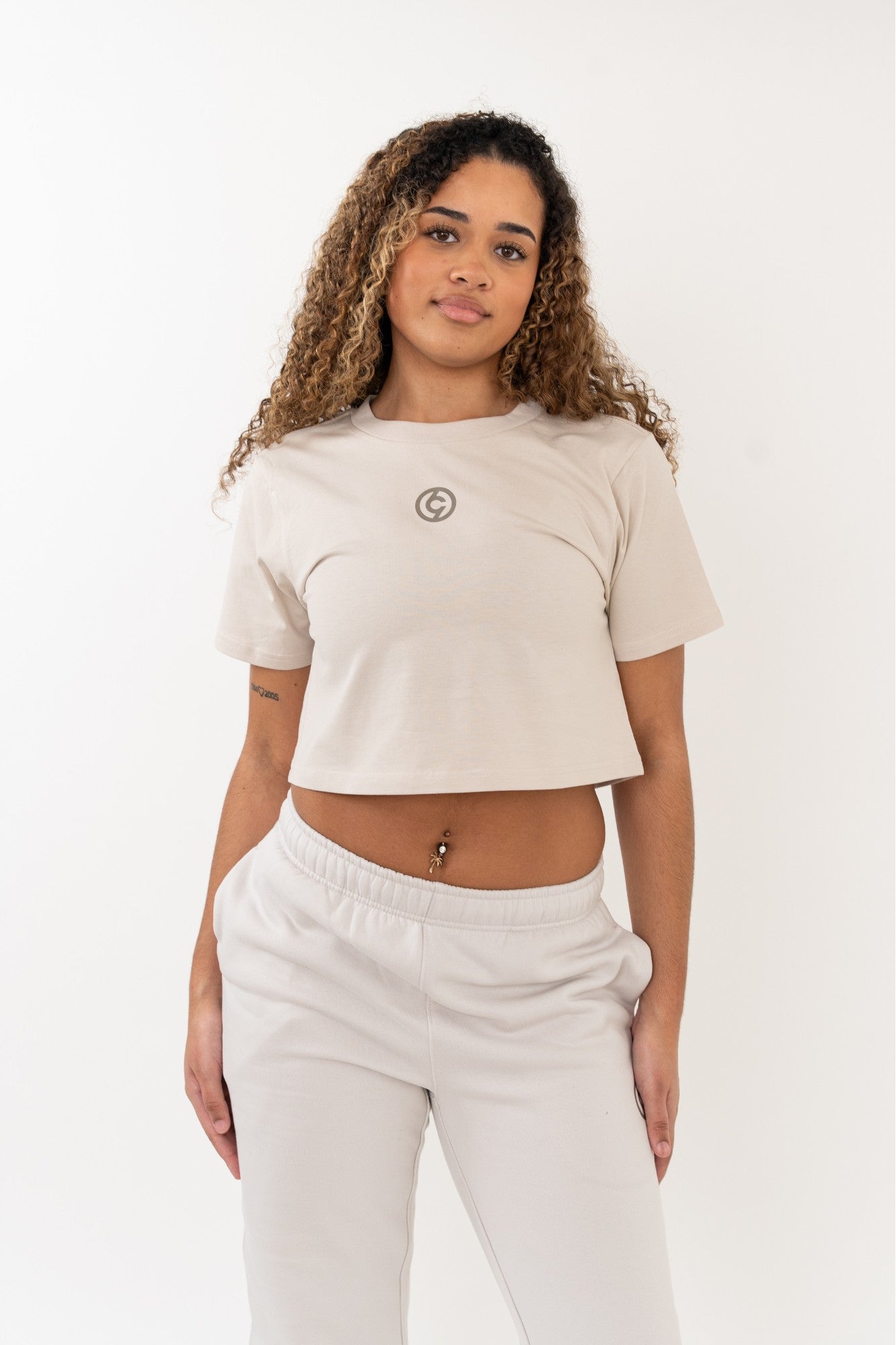 dancer wearing c19 cropped bone tshirt with front detail ready for rehearsal