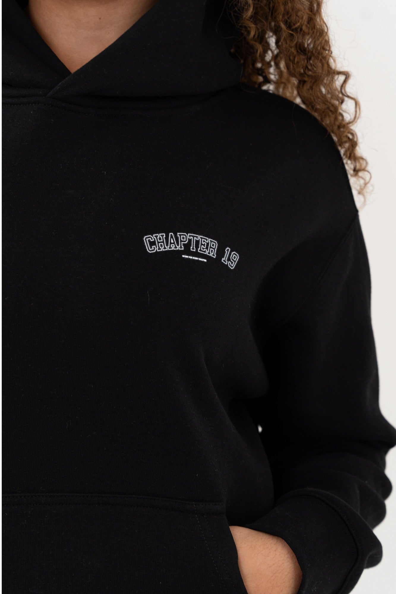 logo detail on chapter 19's womens hoodie