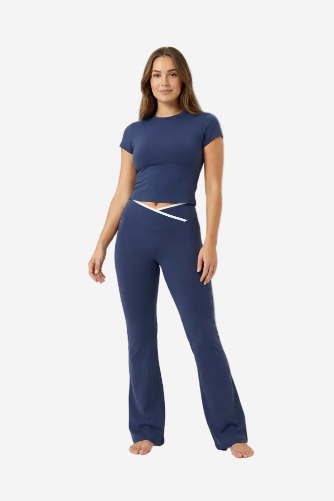 Woman wearing a navy blue outfit on a white background